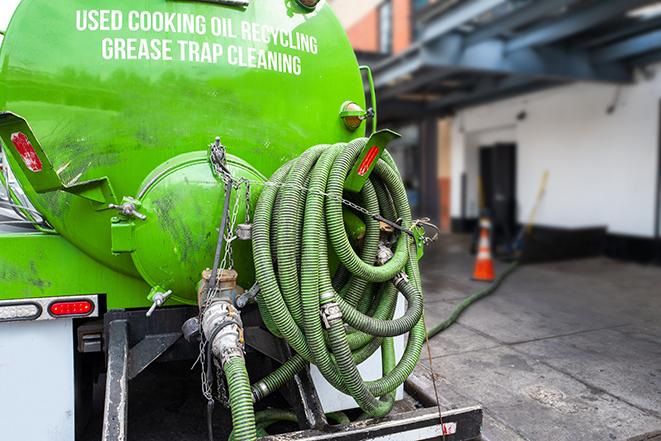 grease trap pumping truck in action in Alexandria, OH